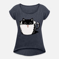 Black kitten with red nose hiding in a cup